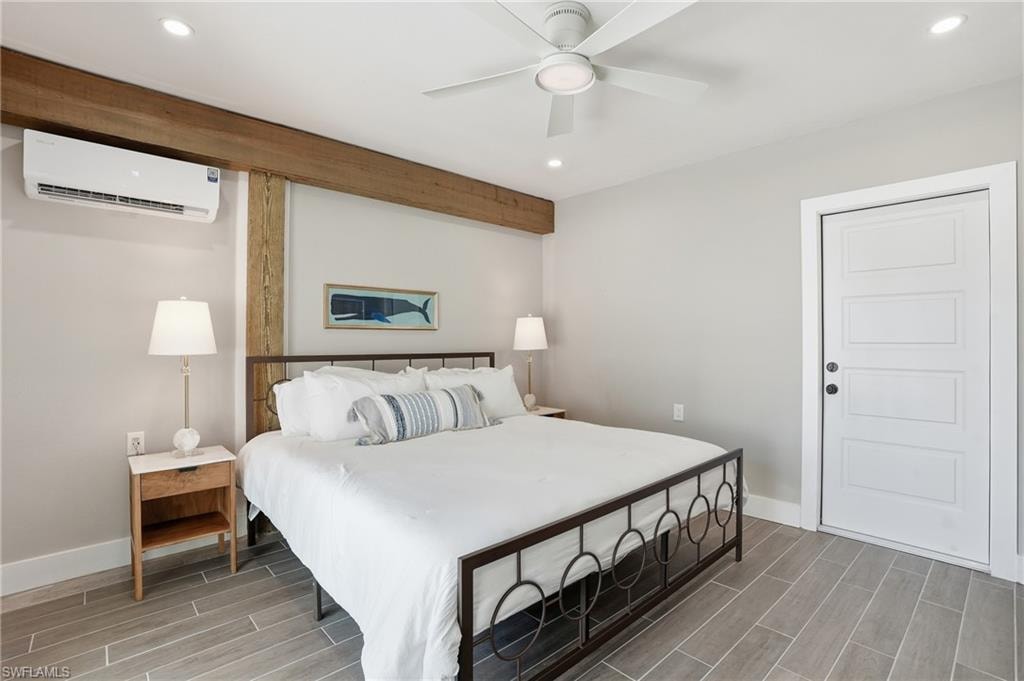 Bedroom featuring wood finish floors, recessed lighting, and ceiling fan - Virtually Edited Image