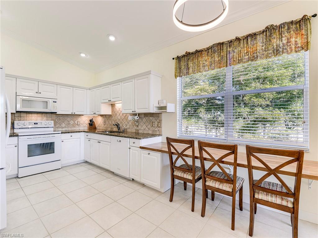 Kitchen with hand-crafted wooden breakfast bar