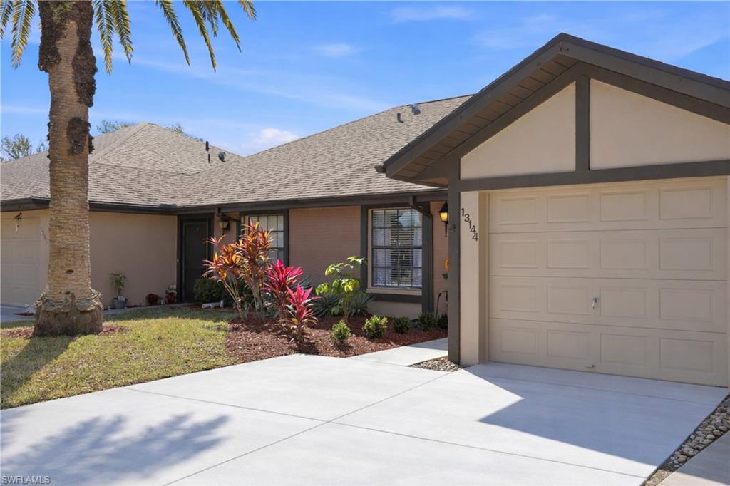 Single story home featuring roof with shingles, a garage, concrete driveway, and stucco siding