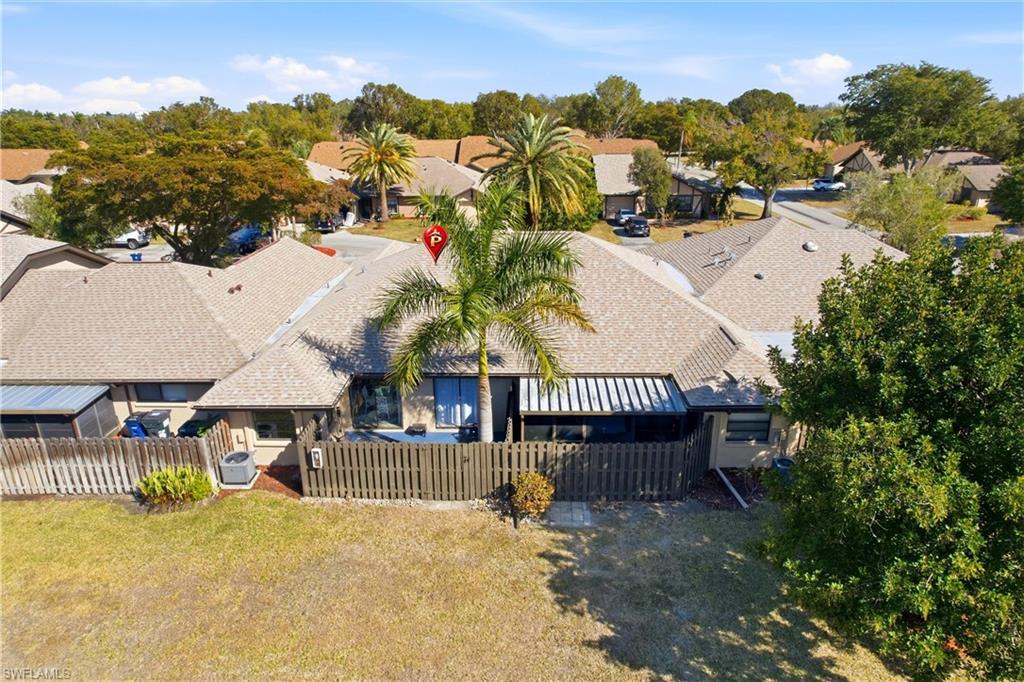Aerial perspective of suburban area featuring a tree filled landscape