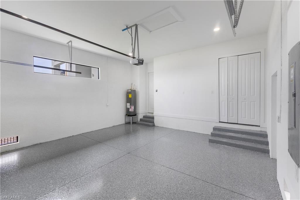 Garage with electric panel and electric water heater