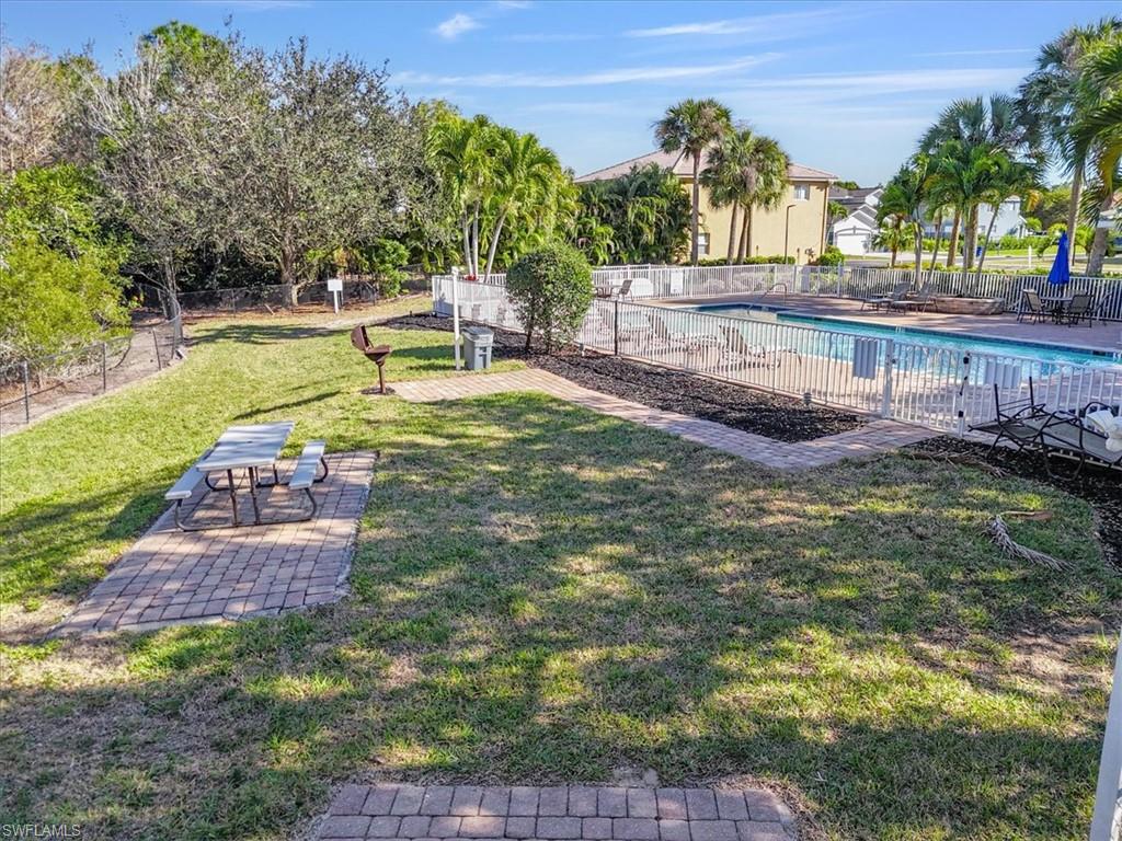 View of yard featuring a patio area and a community pool
