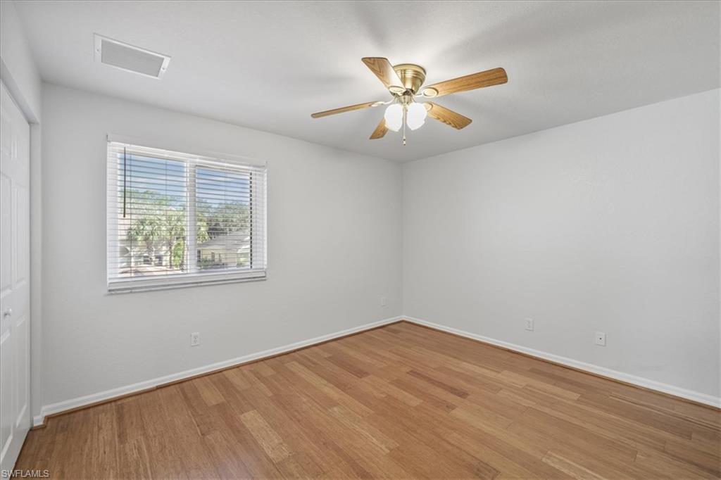 Unfurnished room with light wood-style flooring and a ceiling fan