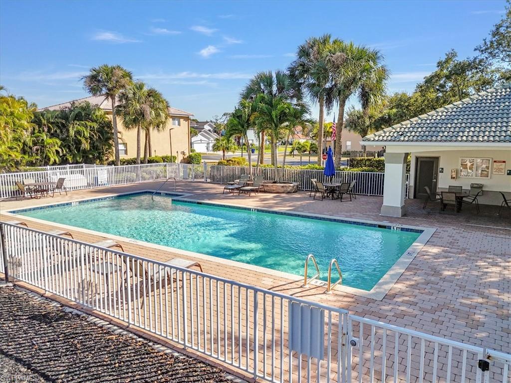 Community pool featuring a patio