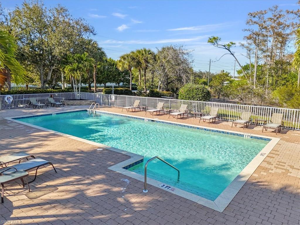 Community pool featuring a patio