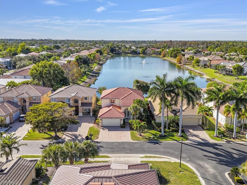 Aerial perspective of suburban area with a large body of water
