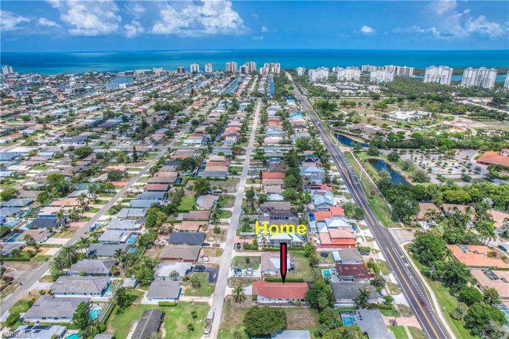 Aerial view of property's location featuring close proximity to World Famous Vanderbilt Beach
