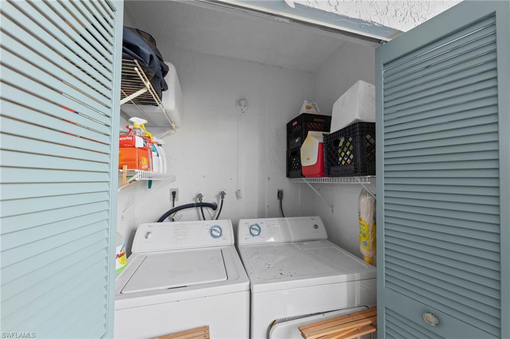 Laundry area featuring washing machine and clothes dryer