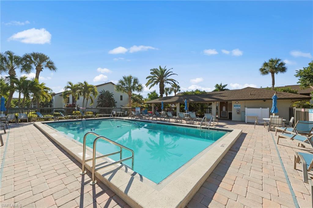 Community pool with a patio