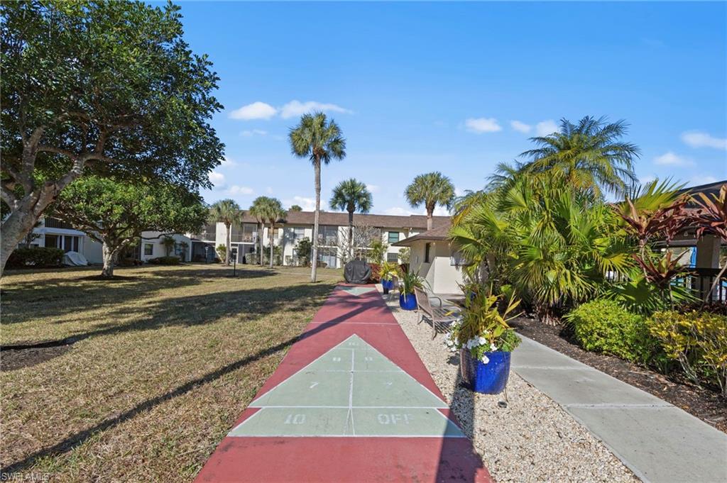 View of property's community with shuffleboard
