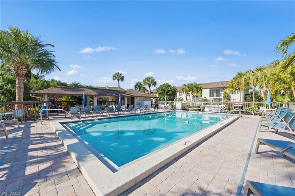 Community pool with a patio area