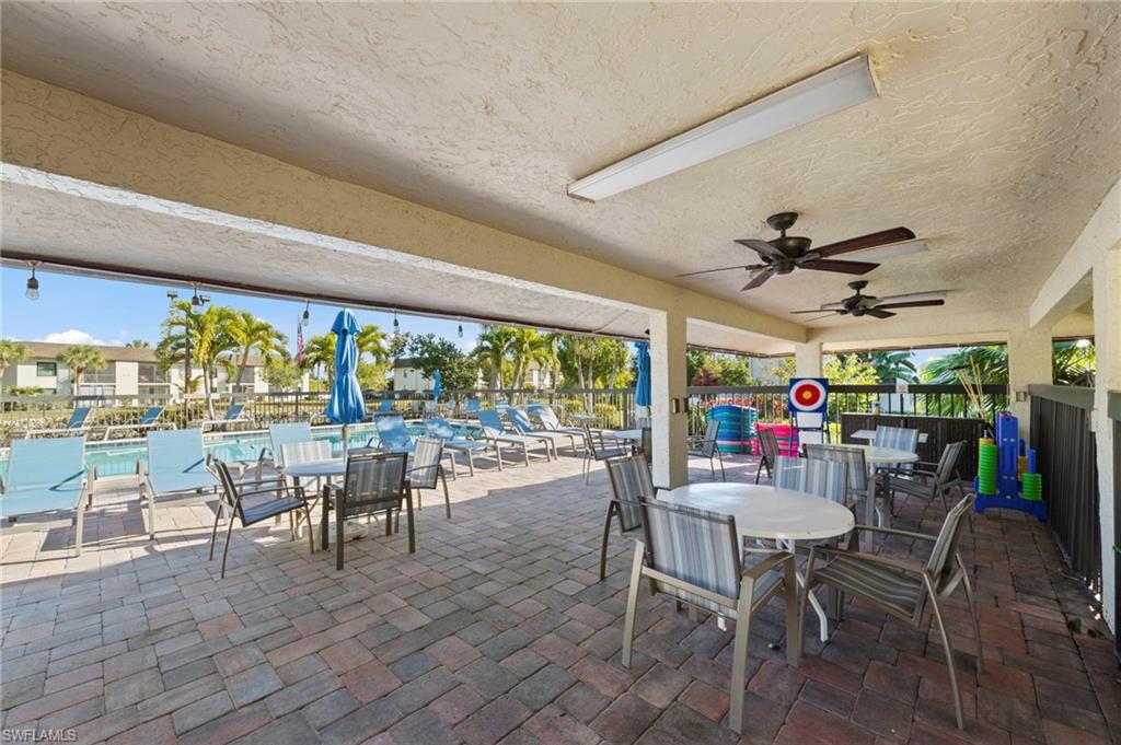 View of patio / terrace with outdoor dining area and ceiling fan