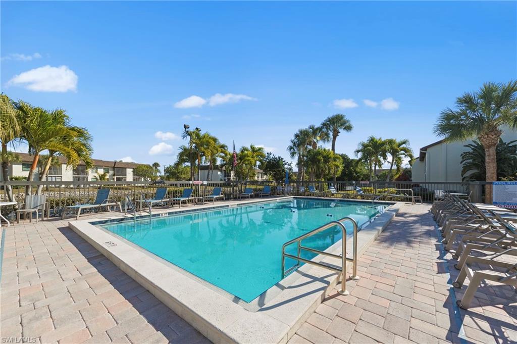 Community pool with a patio