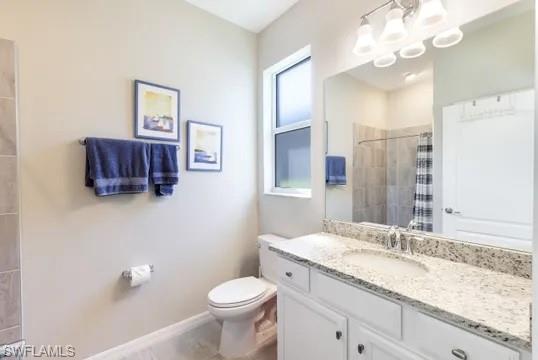 Full bathroom featuring vanity and a tile shower