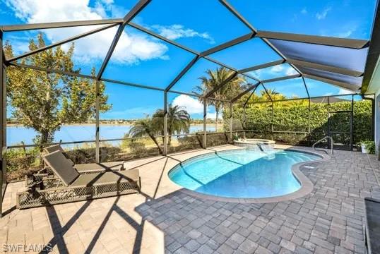 Integrated pool / hot tub with a sunroom, glass enclosure, and a patio