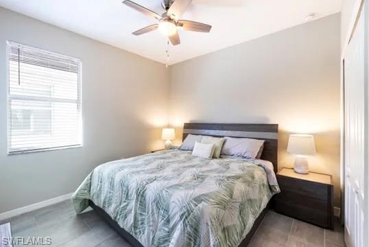 Bedroom featuring a closet and ceiling fan