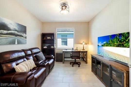 Home office with light tile patterned floors
