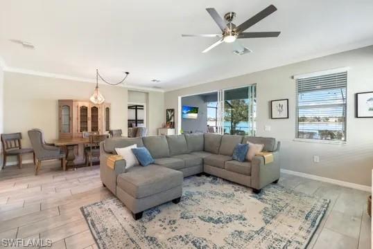 Living area featuring light wood-style flooring and ceiling fan
