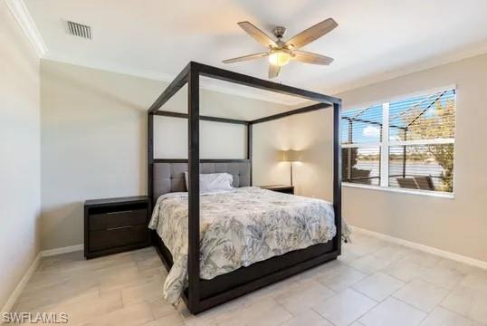 Bedroom with ornamental molding and ceiling fan