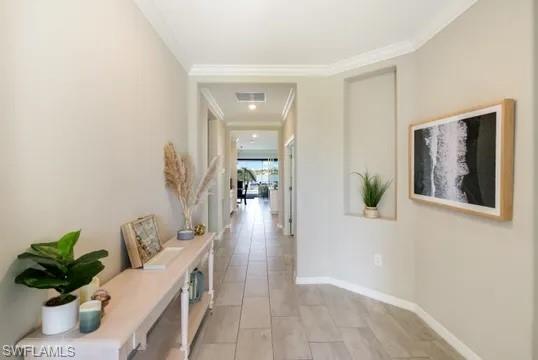 Hallway featuring crown molding