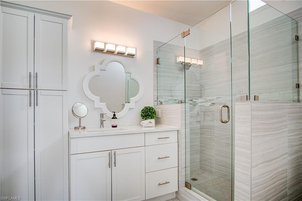Primary ensuite bathroom with glassed walk-in shower