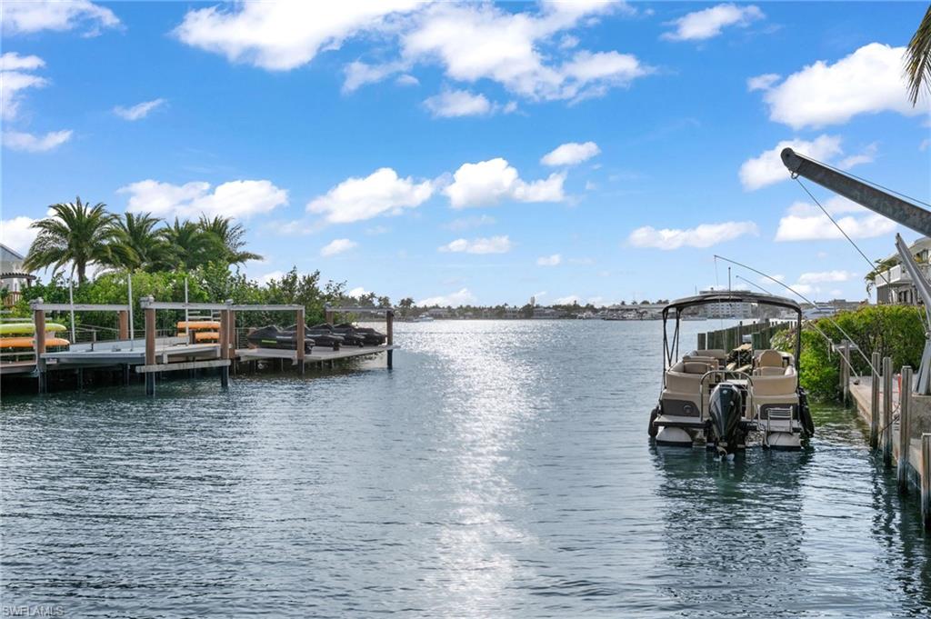 Dock area featuring a water view