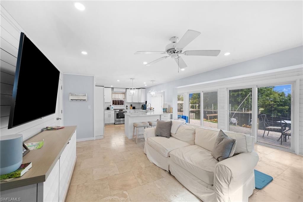 Living room featuring ceiling fan