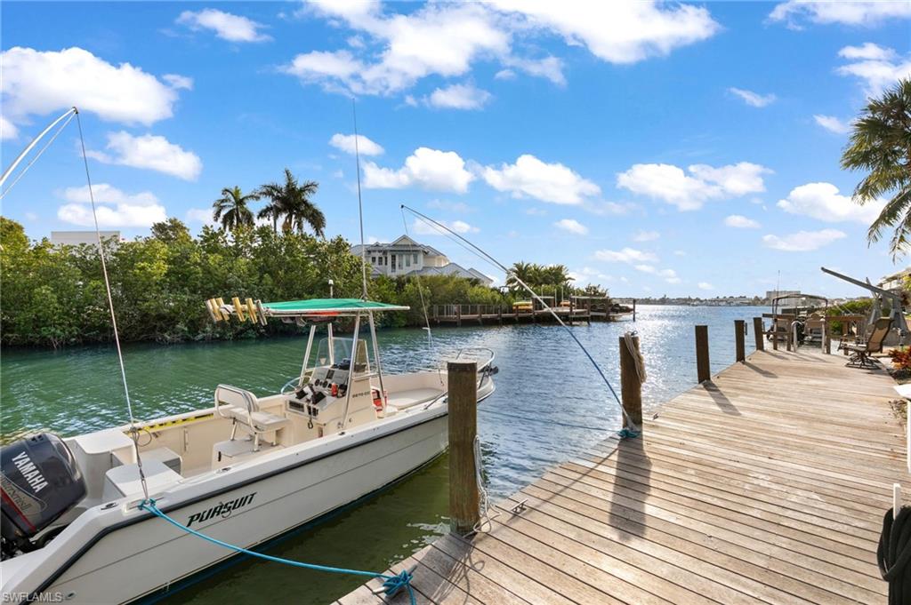 Dock area featuring a water view