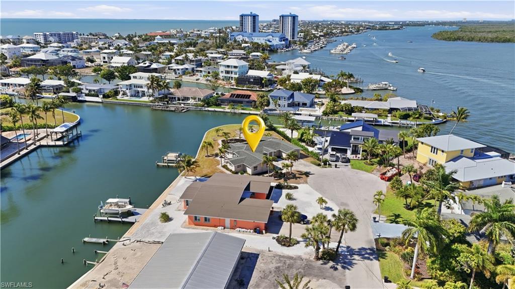 Aerial perspective of suburban area featuring a large body of water - Virtually Edited Image