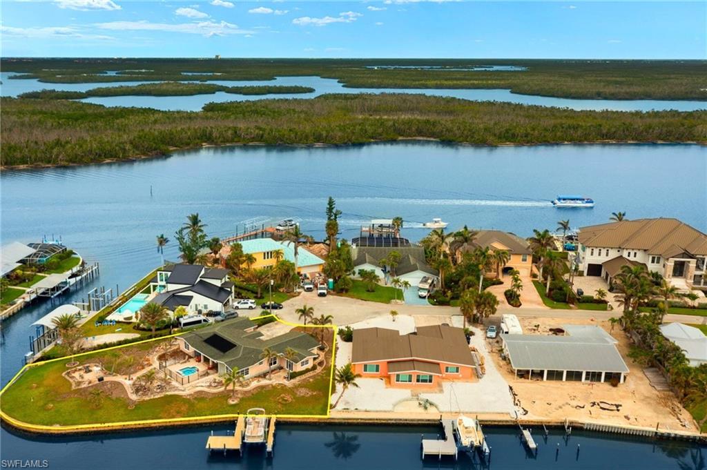 Drone / aerial view featuring a water view virtually enhanced images
