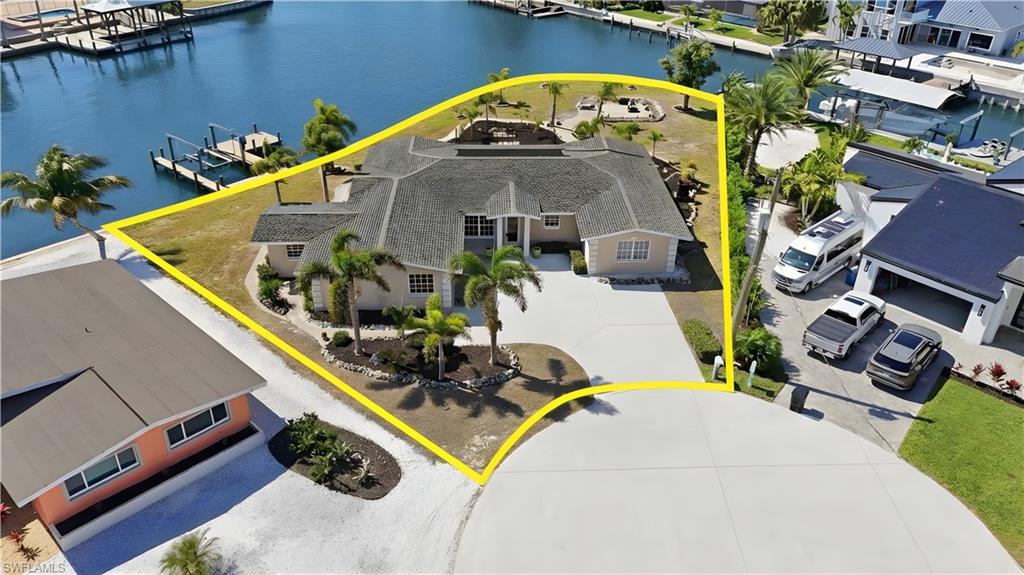 Aerial view of residential area featuring a nearby body of water - Virtually Edited Image