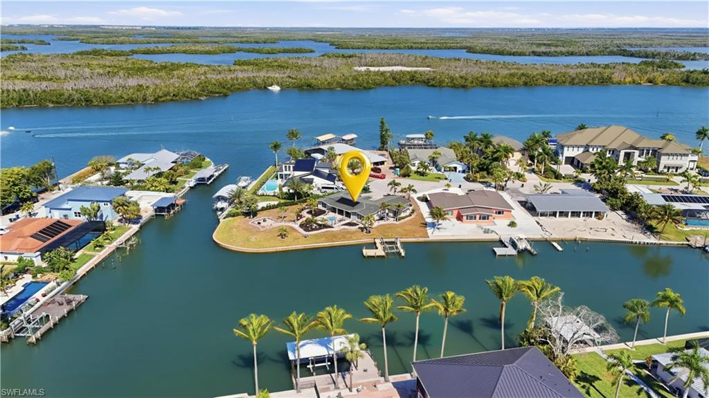Aerial perspective of suburban area with a nearby body of water - Virtually Edited Image