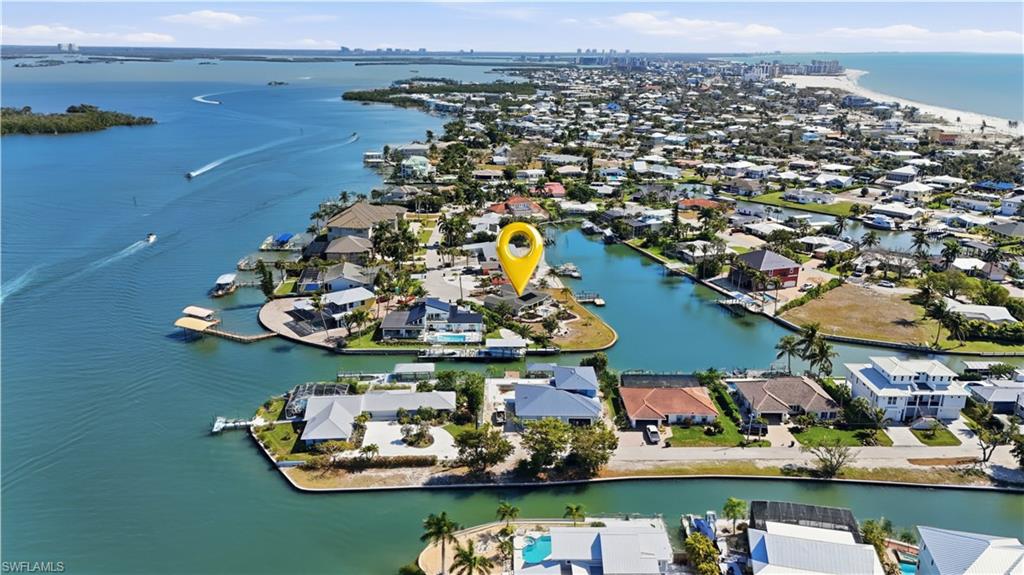 Aerial perspective of suburban area with a large body of water - Virtually Edited Image