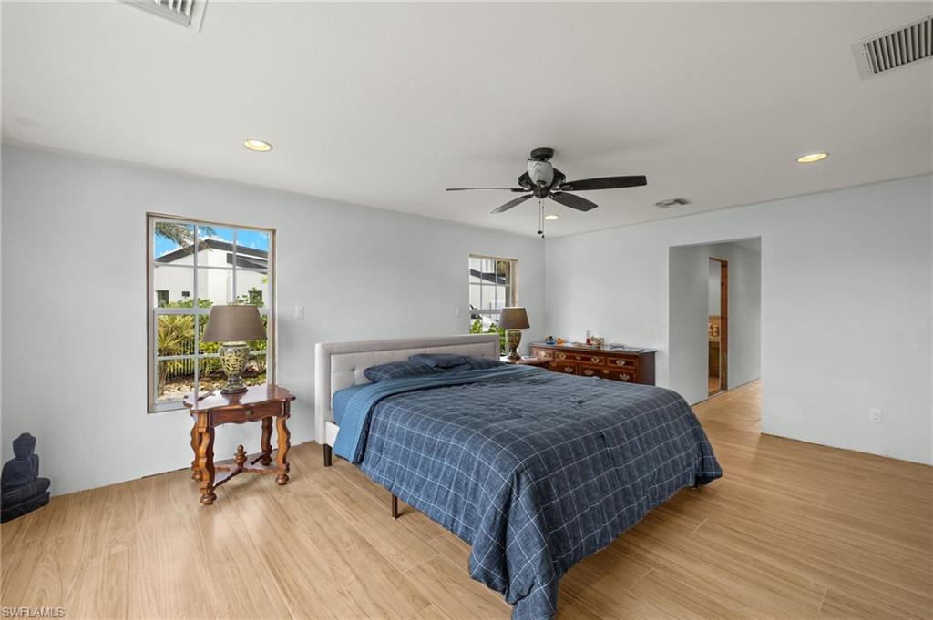 Bedroom featuring light hardwood / wood-style flooring and ceiling fan