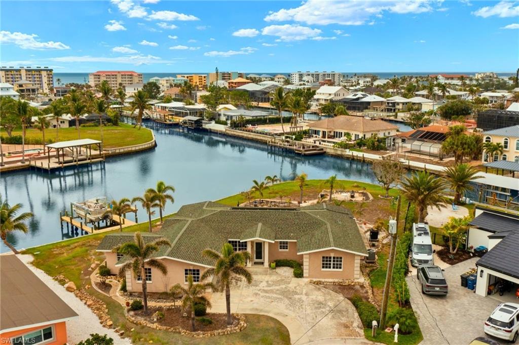 Bird's eye view with a water view virtually enhanced images