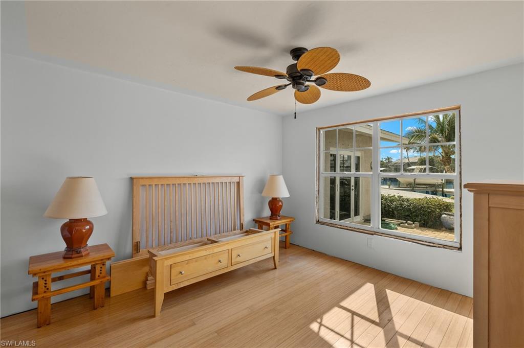 Sitting room featuring light wood-type flooring and ceiling fan