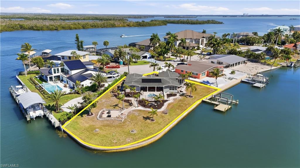 Aerial view of residential area featuring a nearby body of water - Virtually Edited Image
