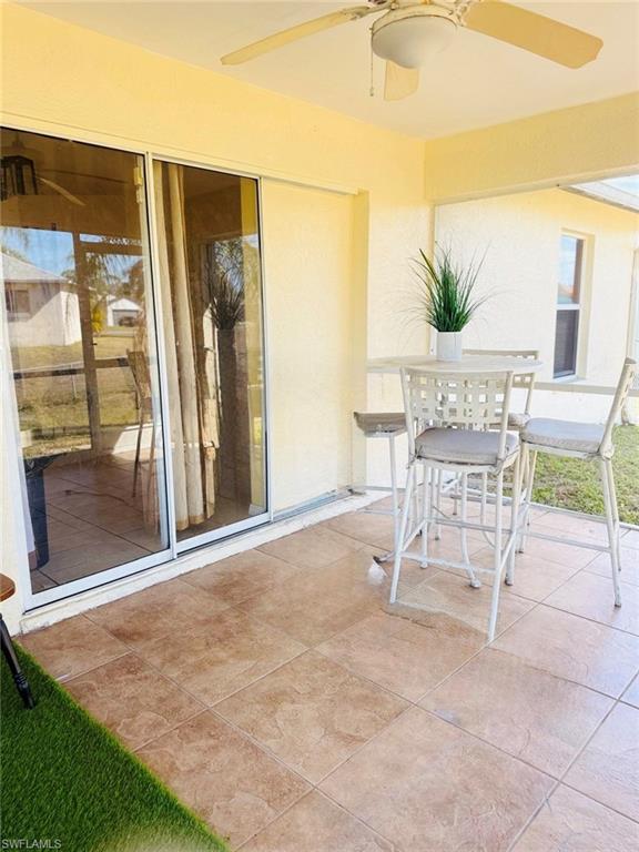 View of patio / terrace featuring a ceiling fan and outdoor dining space