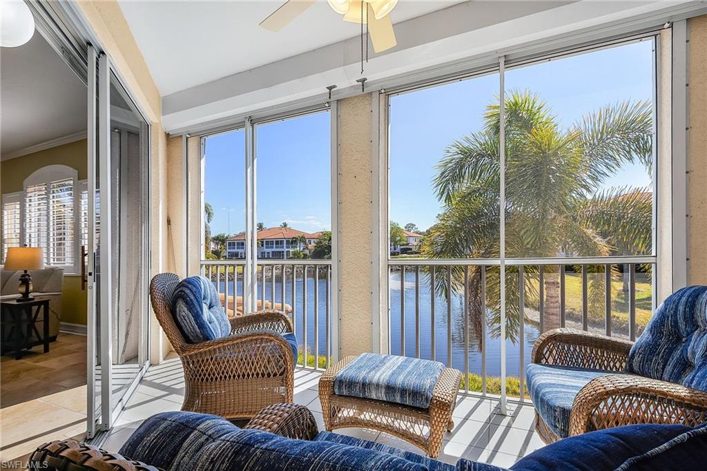 Sunroom with a water view