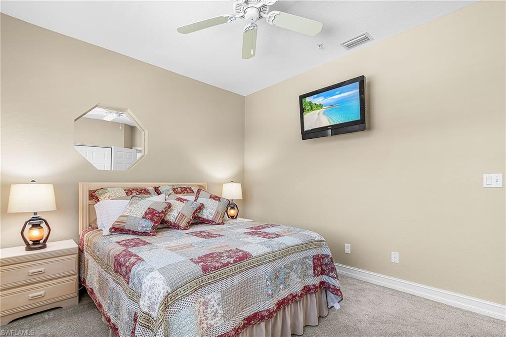 Bedroom with carpet and ceiling fan