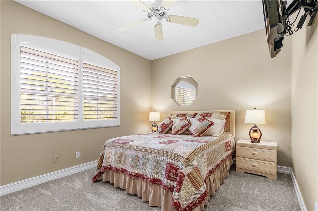 Bedroom featuring carpet flooring and a ceiling fan