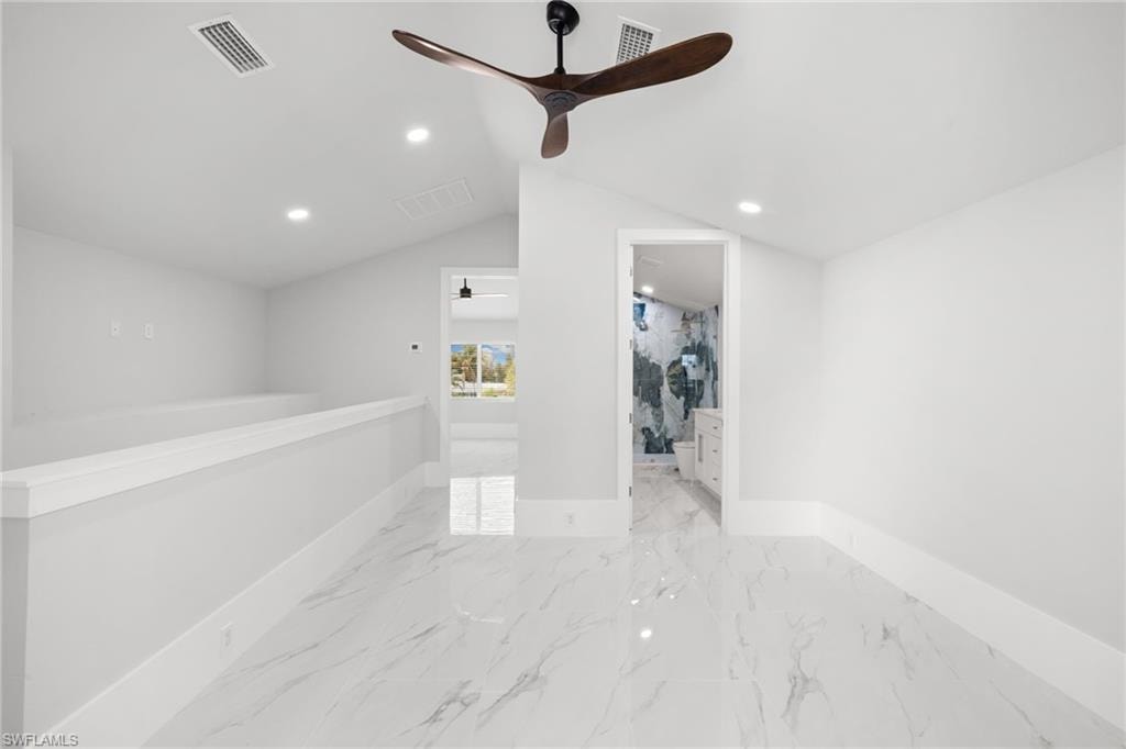 Empty room featuring recessed lighting, ceiling fan, and light marble finish floors