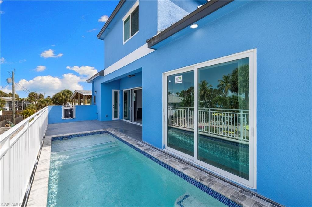 View of pool featuring patio surround
