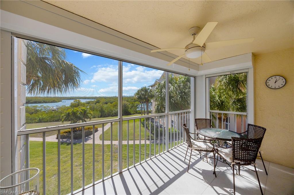Lanai with tile flooring and a water view