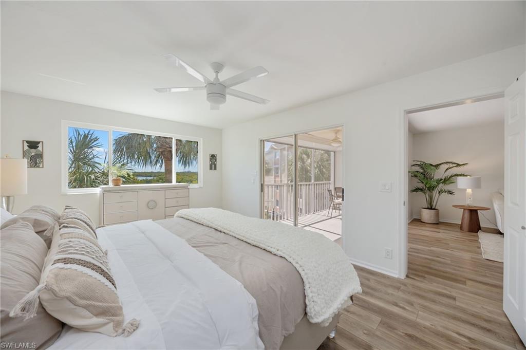 Bedroom featuring light wood-style flooring, access to exterior, and a ceiling fan