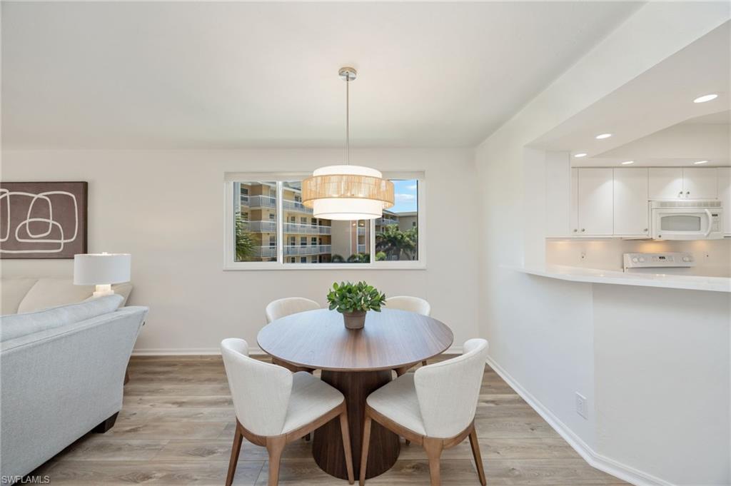 Dining room featuring recessed lighting and light wood-style flooring