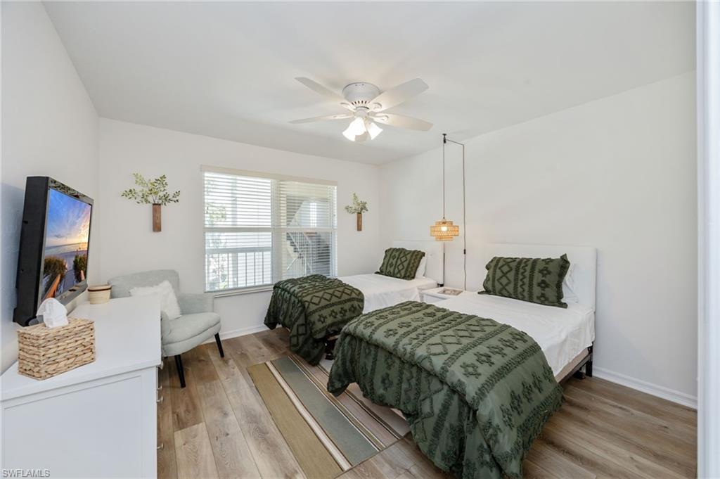 Bedroom featuring hardwood / wood-style flooring and ceiling fan