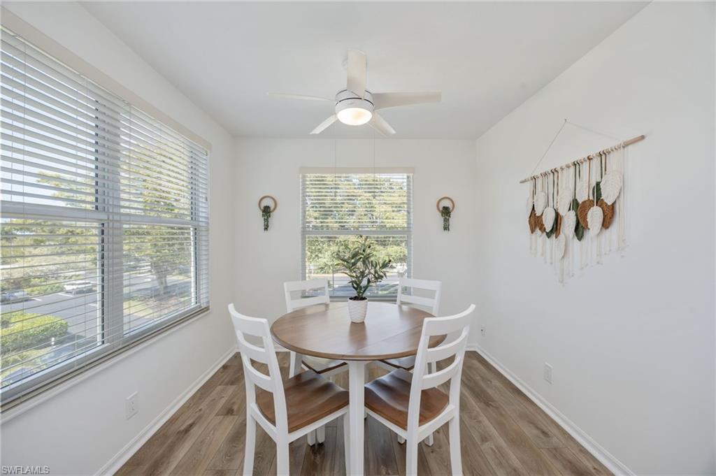 Dining space featuring a ceiling fan and light wood finished floors