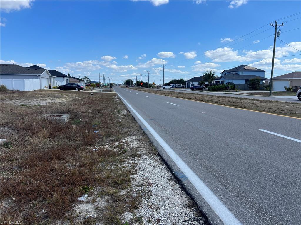 View of asphalt street with a residential view