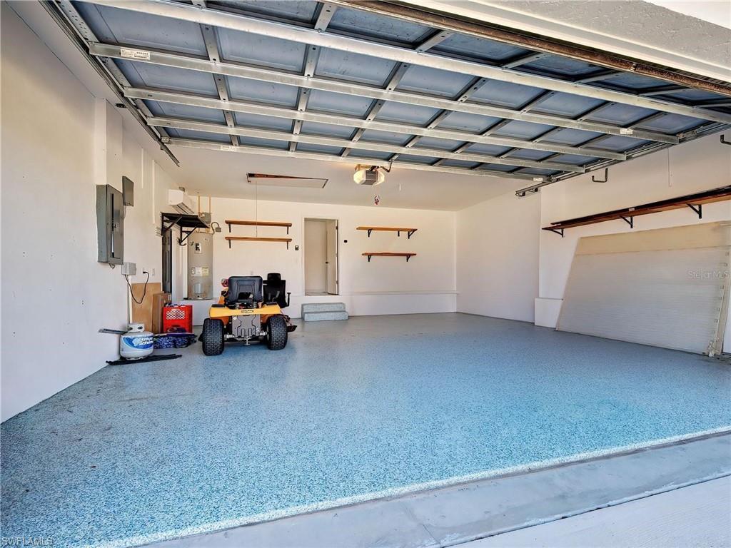 Garage with electric panel and water heater
